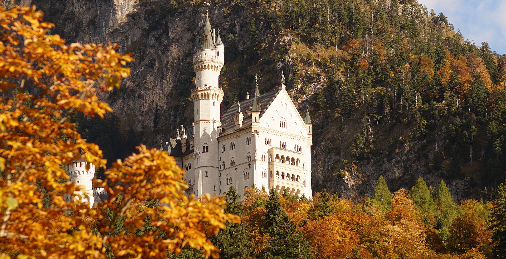 An exterior view of Neuschwanstein Castle in autumn